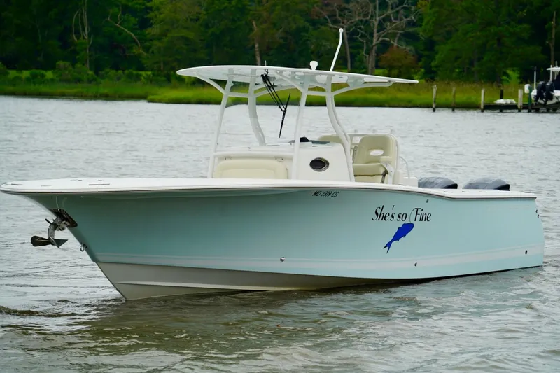 Slide: The Image of 2015 Southport 29 FE boat named "She's so Fine" on a calm river. - 16