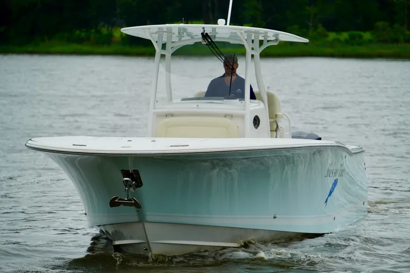 Slide: The Image of 2015 Southport 29 FE boat cruising on a calm river. - 17