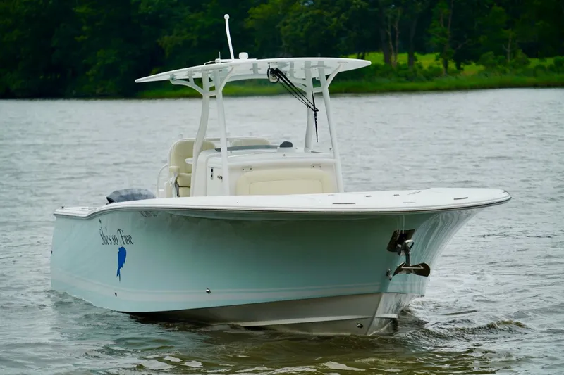 Slide: The Image of 2015 Southport 29 FE boat on calm water, front view. - 19