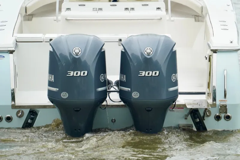 Slide: The Image of 2015 Southport 29 FE boat with dual Yamaha 300 outboard engines in water. - 23