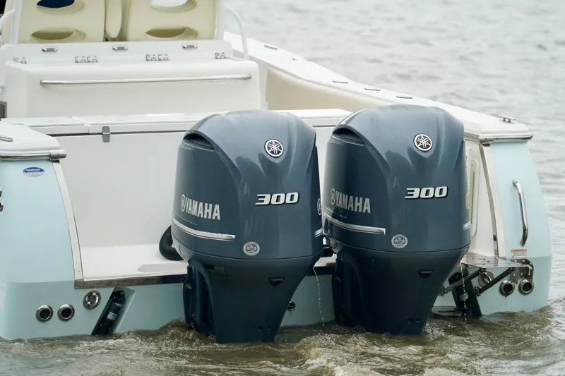 Slide: The Image of 2015 Southport 29 FE boat with dual Yamaha 300 outboard engines on water. - 24