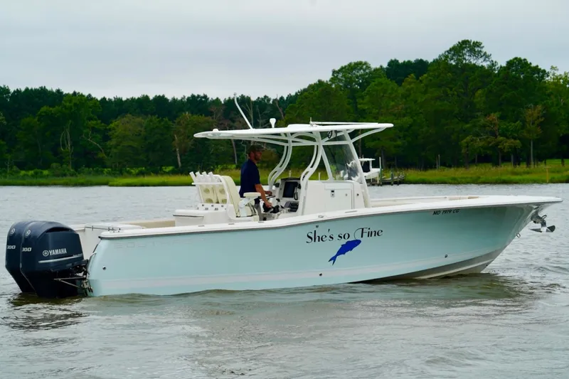 Slide: The Image of 2015 Southport 29 FE boat on water with Yamaha engines, named "She's so Fine." - 3