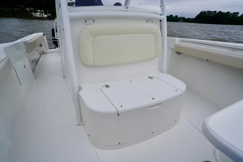 Slide: The Image of 2015 Southport 29 FE boat interior with cushioned seating and storage. - 30