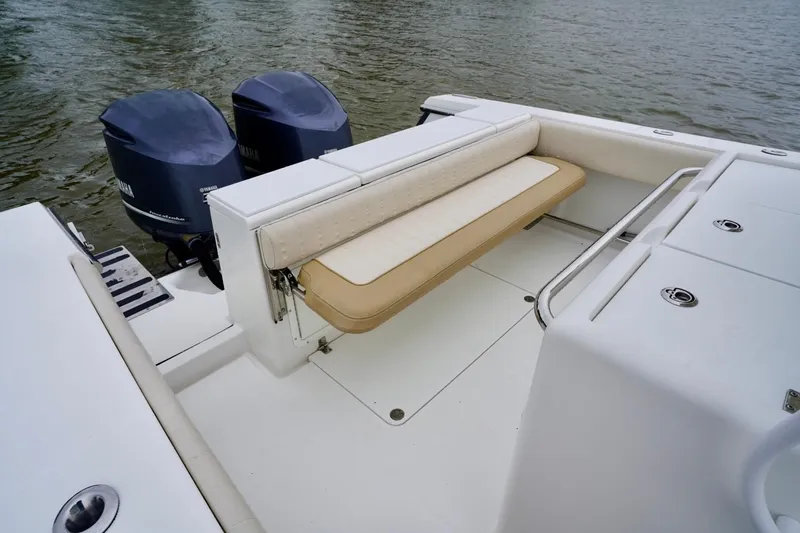 Slide: The Image of 2015 Southport 29 FE boat with dual Yamaha engines and foldable seating. - 38