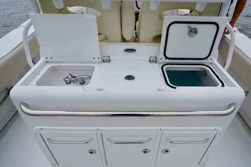 Slide: The Image of 2015 Southport 29 FE boat with sink and storage compartments. - 42