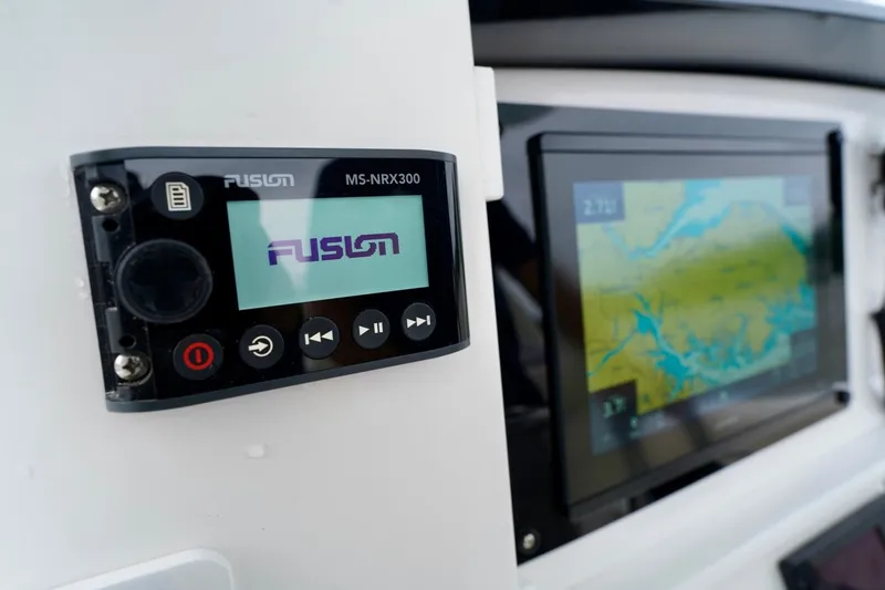 Slide: The Image of Fusion MS-NRX300 marine stereo and navigation display on 2015 Southport 29 FE boat. - 49