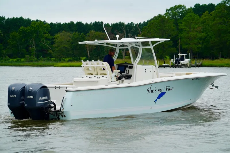 Slide: The Image of 2015 Southport 29 FE boat with dual Yamaha engines on a calm river. - 5