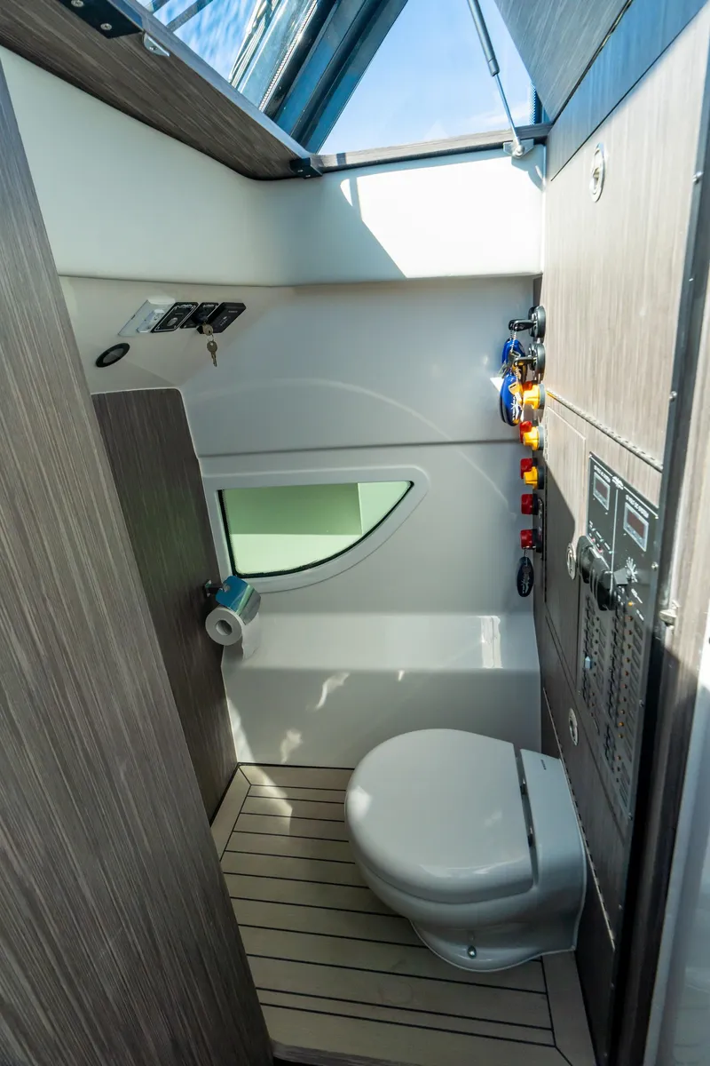 Slide: The Image of Modern bathroom in 2025 Invincible 46 Pilothouse boat with sleek design and natural light. - 12