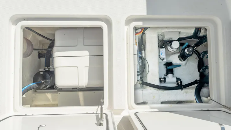 Slide: The Image of 2025 Invincible 46 Pilothouse boat compartments with mechanical and storage systems. - 16