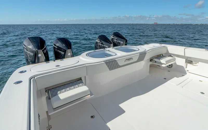 Slide: The Image of 2025 Invincible 46 Pilothouse boat with quad outboard engines on open water. - 18