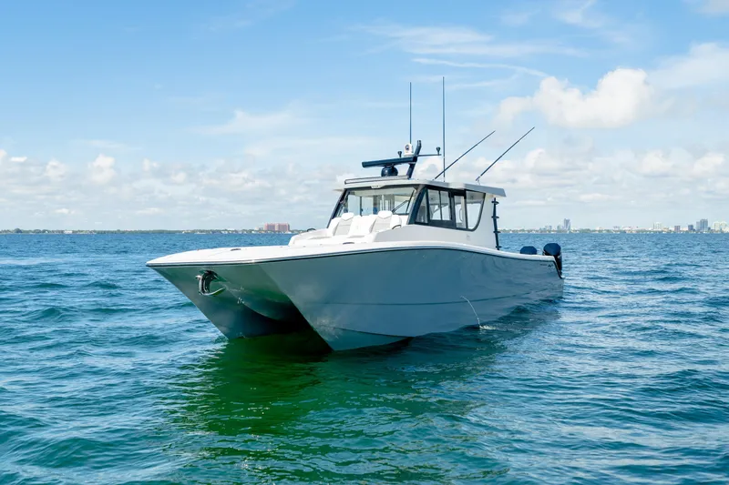 Slide: The Image of 2025 Invincible 46 Pilothouse boat on open water. - 4