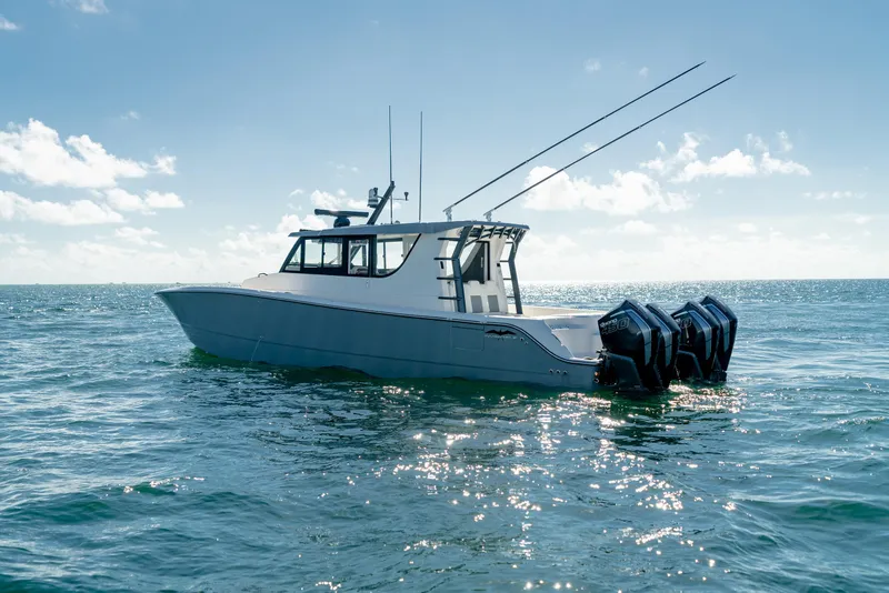 Slide: The Image of 2025 Invincible 46 Pilothouse boat on open water. - 6