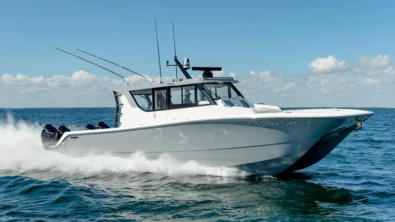 Slide: The Image of 2025 Invincible 46 Pilothouse boat cruising on open water. - 3
