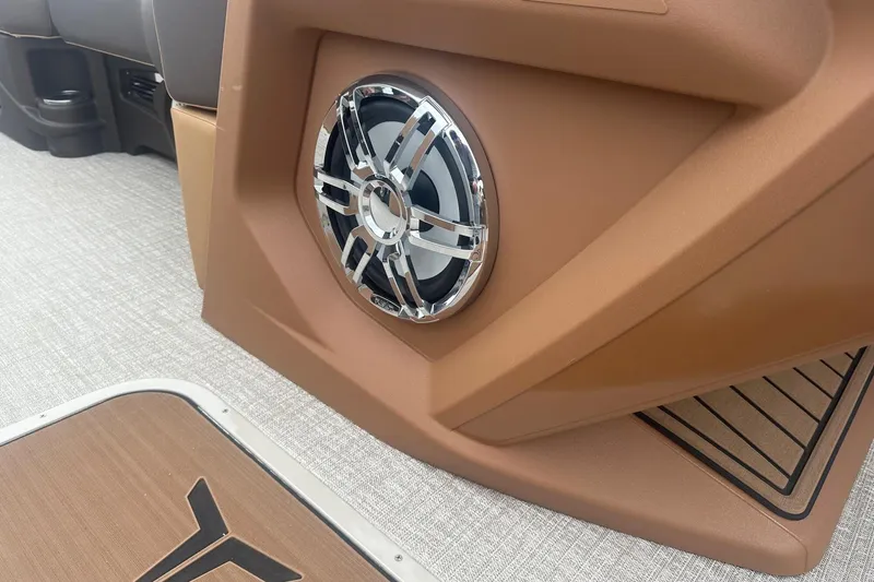 Slide: The Image of 2025 Tahoe 2585 boat interior with sleek speaker and modern design elements. - 12