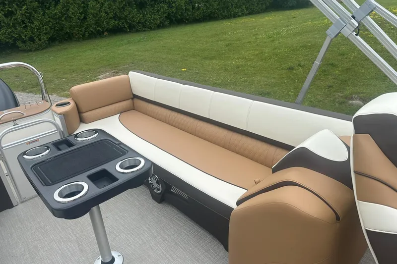 Slide: The Image of Luxurious seating on 2025 Tahoe 2585 boat with cup holders and sleek design. - 16