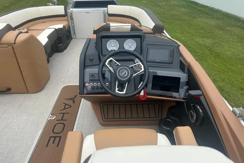 Slide: The Image of 2025 Tahoe 2585 boat interior with modern dashboard and luxurious seating. - 21