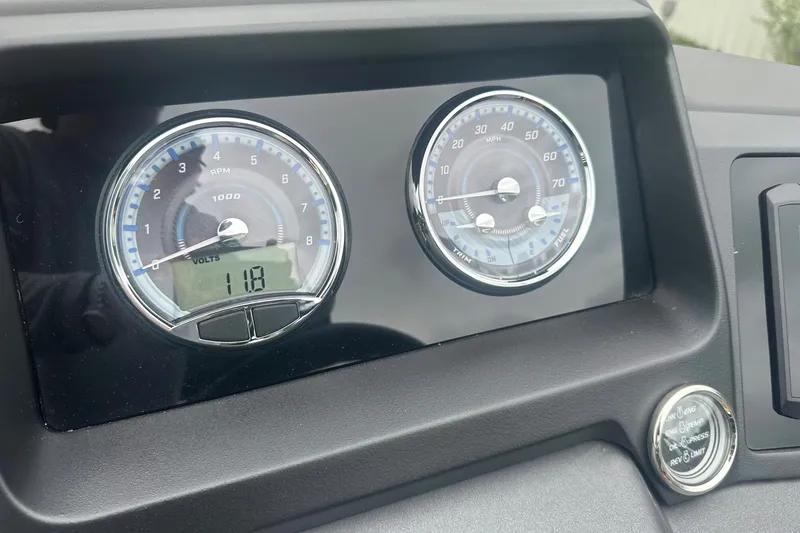 Slide: The Image of Dashboard of 2025 Tahoe 2585 showing RPM and speed gauges. - 23