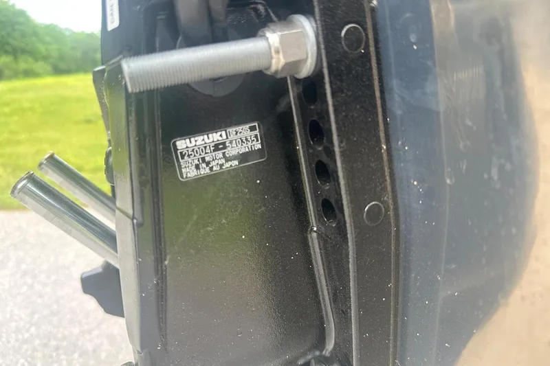 Slide: The Image of Close-up of a Suzuki motor part on a 2025 Tahoe 2585 boat. - 25