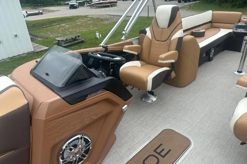 Slide: The Image of Luxurious interior of 2025 Tahoe 2585 boat with plush seating and modern dashboard. - 28