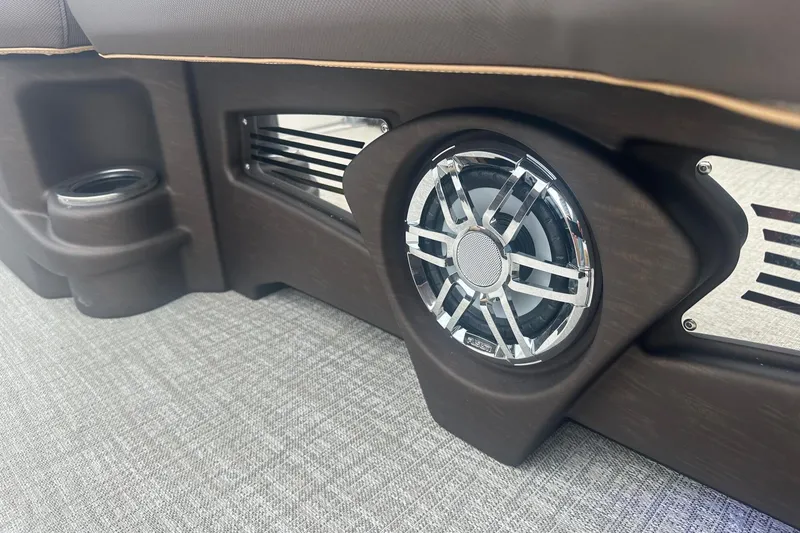 Slide: The Image of 2025 Tahoe 2585 interior speaker and cup holder on textured flooring. - 32