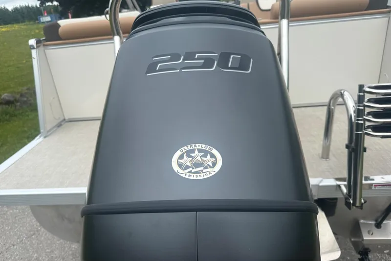 Slide: The Image of 2025 Tahoe 2585 boat engine with 250 horsepower, ultra-low emissions badge. - 6