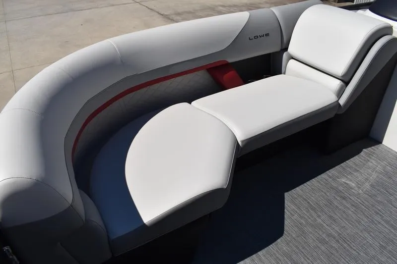 Slide: The Image of Interior of 2026 Lowe SS 210 WT boat with open storage compartment. - 12