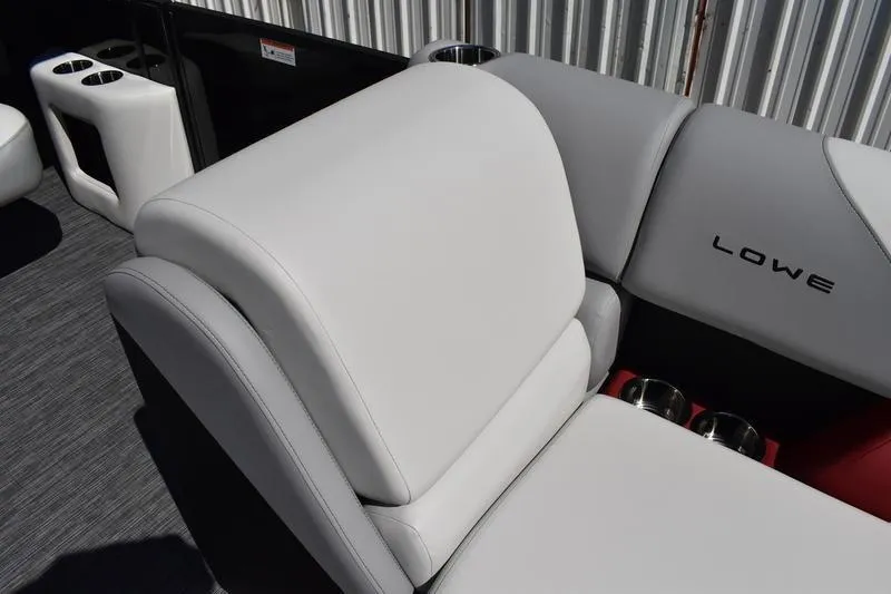 Slide: The Image of Interior of 2026 Lowe SS 210 WT boat with cup holders and storage compartment. - 14