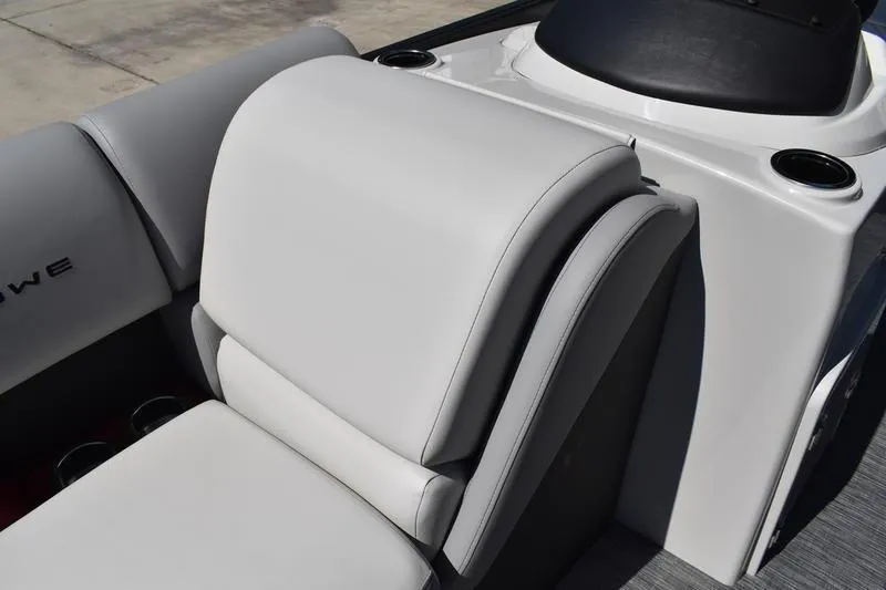 Slide: The Image of 2026 Lowe SS 210 WT boat interior with white seating and cup holders. - 18