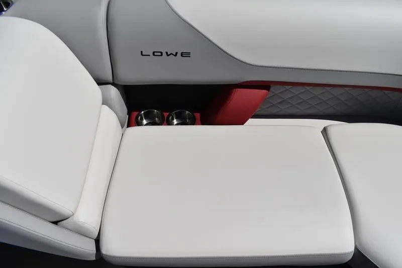Slide: The Image of 2026 Lowe SS 210 WT boat storage compartment with quilted upholstery and red accents. - 20