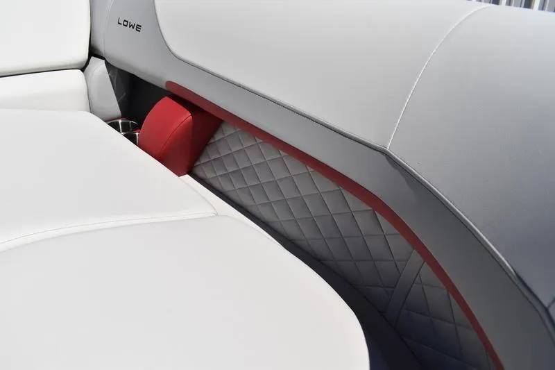 Slide: The Image of 2026 Lowe SS 210 WT pontoon boat interior with gray seating and cup holders. - 22
