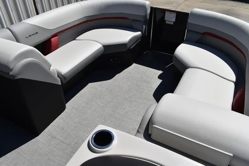 Slide: The Image of 2026 Lowe SS 210 WT boat interior with white seating and cup holders. - 28