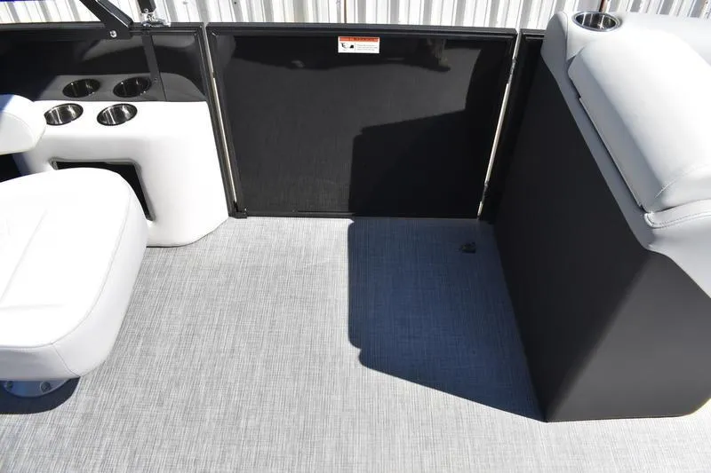 Slide: The Image of Interior of 2026 Lowe SS 210 WT boat with cup holders and white seating. - 29