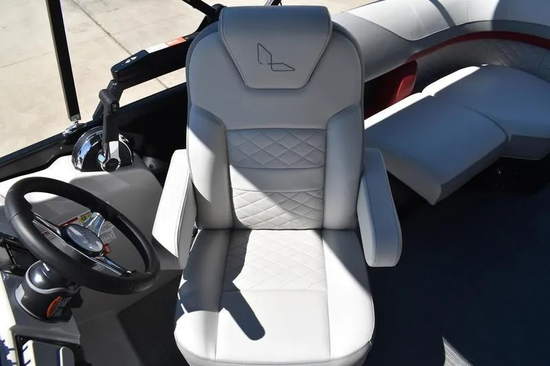 Slide: The Image of 2026 Lowe SS 210 WT boat interior with plush seating and modern design. - 30