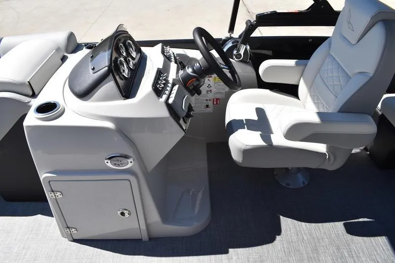 Slide: The Image of 2026 Lowe SS 210 WT boat interior with steering console and captain's chair. - 31