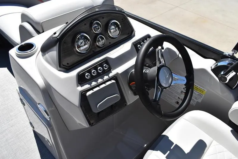 Slide: The Image of Open storage compartment on 2026 Lowe SS 210 WT boat, featuring sleek design and modern lighting. - 32