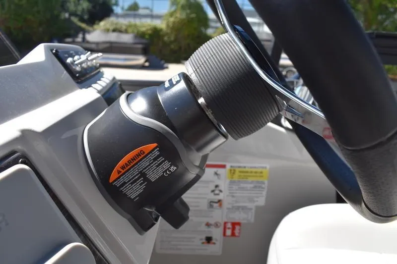 Slide: The Image of Steering wheel of 2026 Lowe SS 210 WT boat, featuring modern dashboard controls. - 40