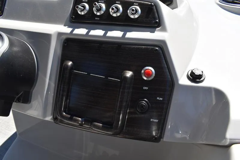 Slide: The Image of 2026 Lowe SS 210 WT boat interior with cushioned seating and table with cup holders. - 41