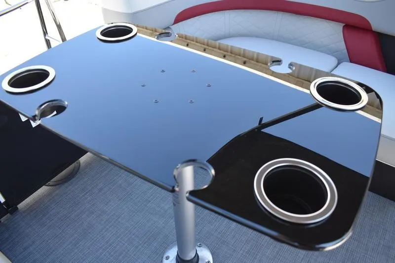 Slide: The Image of 2026 Lowe SS 210 WT boat seating with white and red upholstery, featuring cup holders. - 44