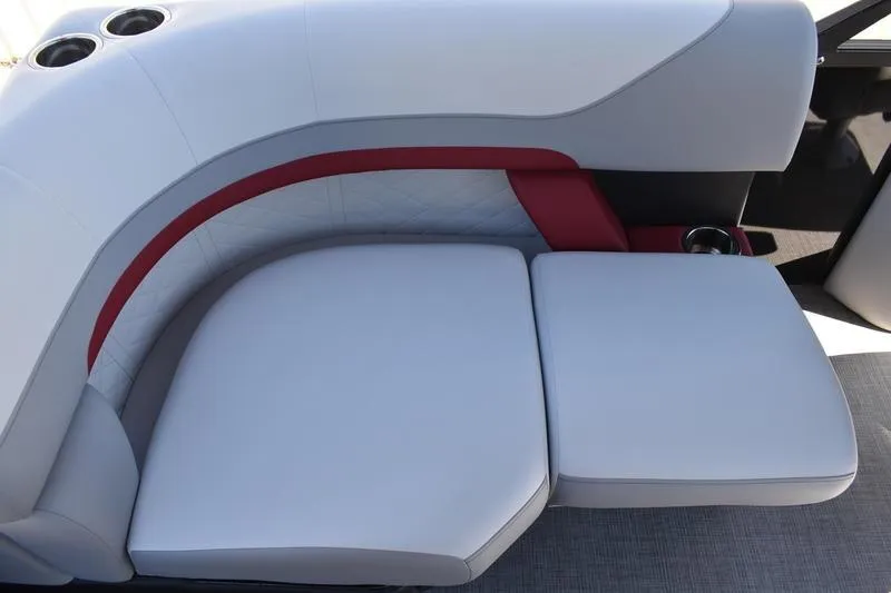 Slide: The Image of 2026 Lowe SS 210 WT boat interior with red and white seating and cup holder. - 45