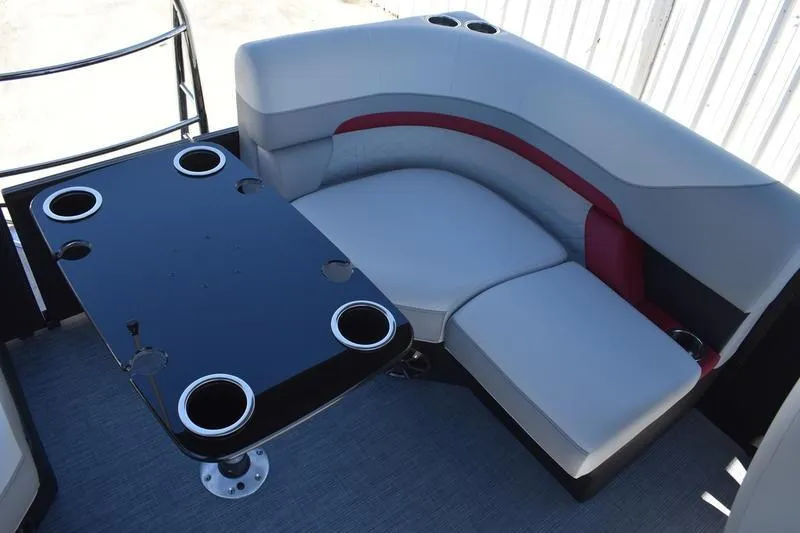 Slide: The Image of Interior of 2026 Lowe SS 210 WT boat with storage compartment and cup holder. - 48