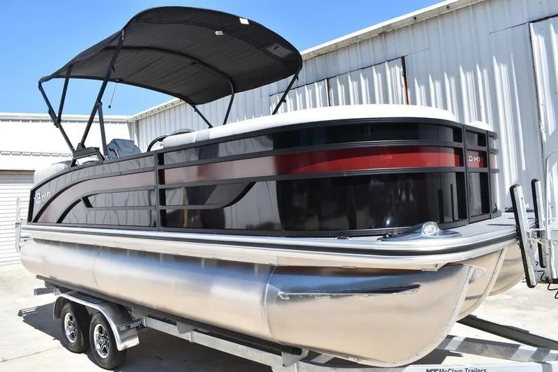 Slide: The Image of 2026 Lowe SS 210 WT pontoon boat on trailer, featuring sleek design and modern finish. - 7