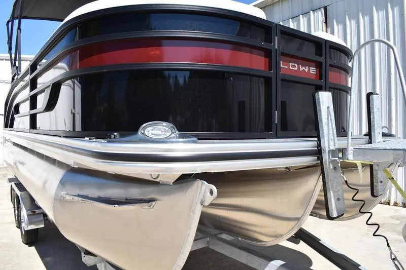 Slide: The Image of 2026 Lowe SS 210 WT boat interior with white cushioned seating and gray flooring. - 9