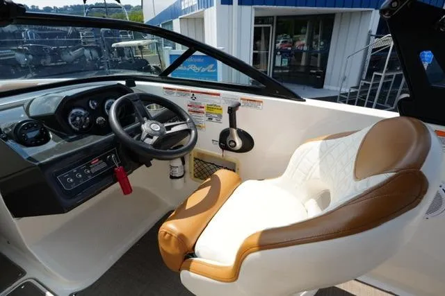Slide: The Image of 2019 Bayliner VR5 Bowrider I/O cockpit with steering wheel and cushioned seat. - 12