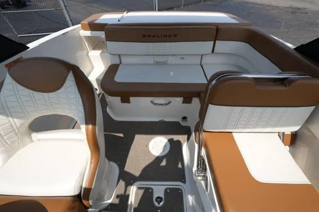 Slide: The Image of 2019 Bayliner VR5 Bowrider I/O interior with brown and white seating, showcasing modern design. - 14