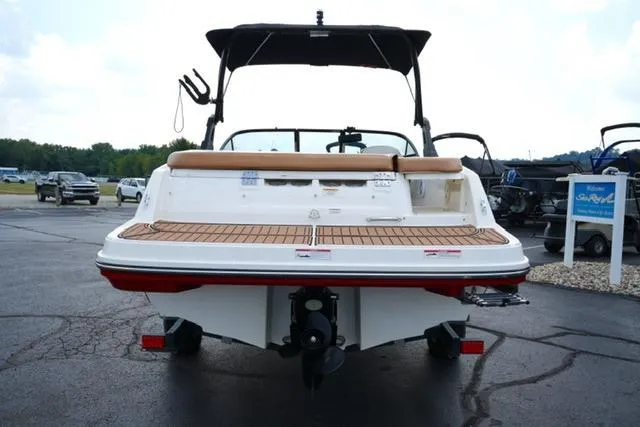 Slide: The Image of 2019 Bayliner VR5 Bowrider I/O boat, rear view, parked on asphalt, with swim platform. - 5