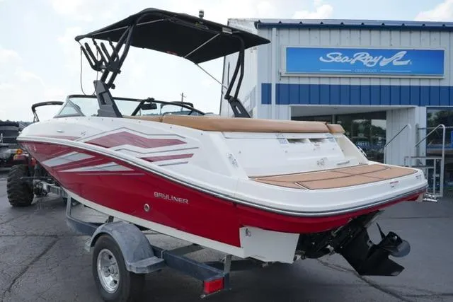 Slide: The Image of 2019 Bayliner VR5 Bowrider I/O boat on trailer, red and white design, parked outside dealership. - 6