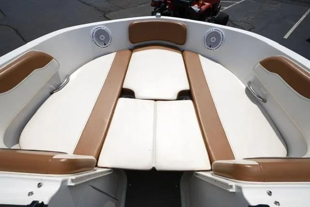 Slide: The Image of 2019 Bayliner VR5 Bowrider I/O boat interior with tan and white seating. - 8
