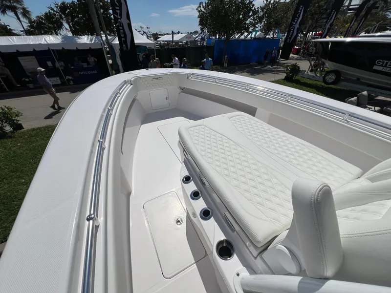 Slide: The Image of 2024 Invincible 33 Open Fisherman boat with white cushioned seating and deck. - 7