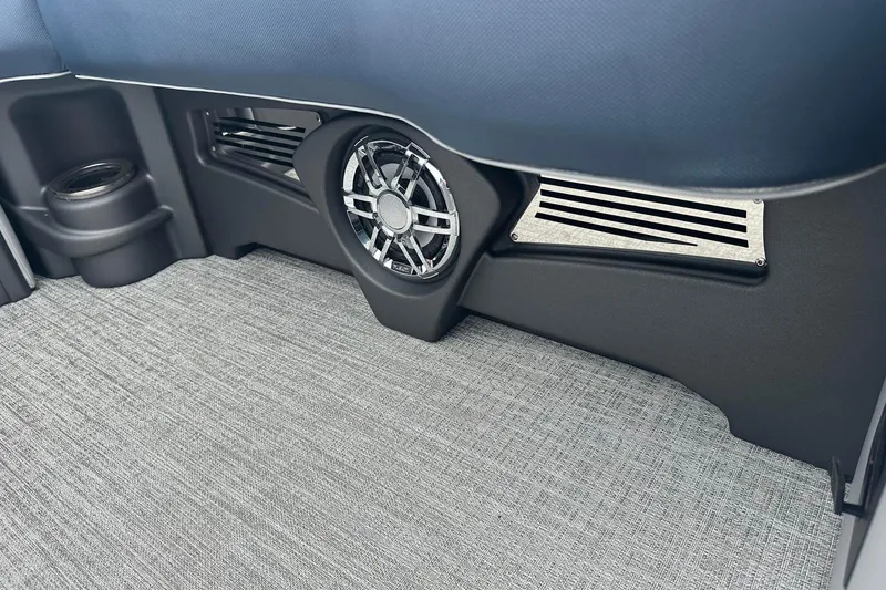 Slide: The Image of 2025 Tahoe 2585 interior detail with speaker and vent on textured flooring. - 14