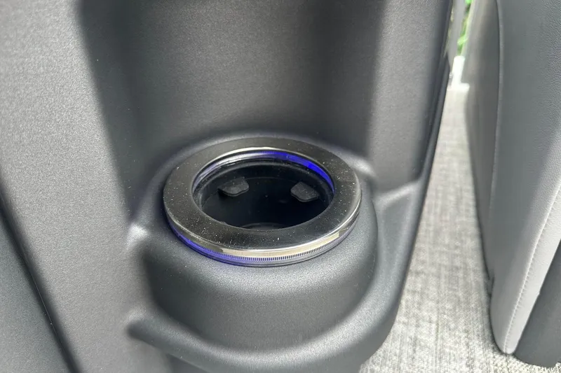 Slide: The Image of 2025 Tahoe 2585 cup holder with sleek design and blue accent lighting. - 15